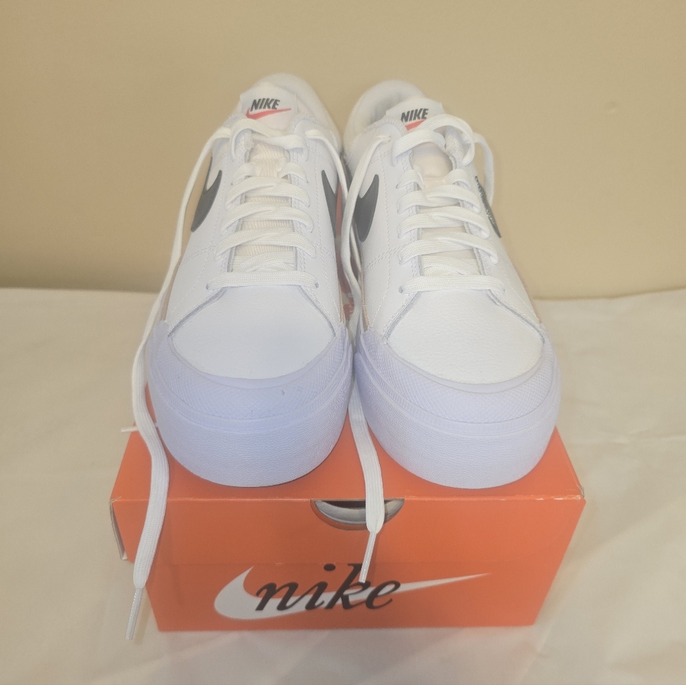 Nike White Platform Sneakers with Black Swoosh